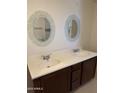 Bathroom with double vanity and large mirrors at 469 W Newmont St, Superior, AZ 85173