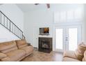 Living room features a fireplace, two sofas, and access to upper level loft at 602 N May St # 47, Mesa, AZ 85201