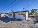 Newly renovated single story home with a modern facade and gated front yard at 6323 N 65Th Dr, Glendale, AZ 85301