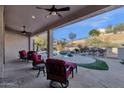 Relaxing backyard oasis with a sparkling pool and patio furniture at 7920 E Sierra Morena E Cir, Mesa, AZ 85207