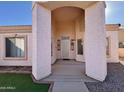 Front entrance with arched entryway and decorative screen door at 9561 W Debbie Pl, Arizona City, AZ 85123