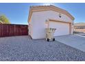 Attached two-car garage with a separate door at 9561 W Debbie Pl, Arizona City, AZ 85123