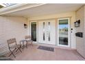 Front entry with double doors and welcoming patio at 9729 W Pinecrest Dr, Sun City, AZ 85351