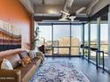 Living room with city views and a leather couch at 1 E Lexington Ave # 1507, Phoenix, AZ 85012