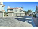 Condo building with parking lot and desert landscaping at 10115 E Mountain View Rd # 2022, Scottsdale, AZ 85258