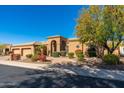 Beautiful home exterior with landscaping and a three-car garage at 12159 N 120Th Way, Scottsdale, AZ 85259