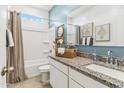 Bathroom with granite countertops and a bathtub at 1216 S Mullberry St, Florence, AZ 85132