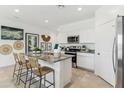 Modern kitchen features granite countertops and white cabinetry at 1216 S Mullberry St, Florence, AZ 85132