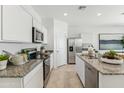 Modern kitchen with stainless steel appliances and granite countertops at 1216 S Mullberry St, Florence, AZ 85132