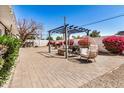 Spacious backyard patio featuring a cozy seating area, beautiful landscaping, and a tranquil ambiance at 1815 N 74Th St, Scottsdale, AZ 85257