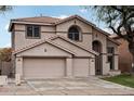 Two-story house with a three-car garage and neutral color scheme at 26645 N 42Nd St, Cave Creek, AZ 85331