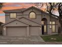 Two-story house with a three-car garage and neutral color scheme at 26645 N 42Nd St, Cave Creek, AZ 85331