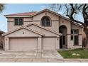 Two-story house with a three-car garage and neutral color scheme at 26645 N 42Nd St, Cave Creek, AZ 85331