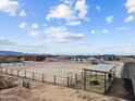 Expansive property featuring a horse enclosure, perfect for equestrian enthusiasts in a rural setting at 28813 N 201St Ave, Wittmann, AZ 85361