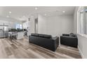 Open concept living room and kitchen with modern finishes at 28813 N 201St Ave, Wittmann, AZ 85361