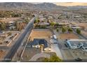 Aerial view showcasing a single-story home, expansive backyard, and surrounding neighborhood at 2911 W Latona Rd # 1, Laveen, AZ 85339