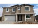 Two-story house with a neutral color scheme and a white door at 7662 W Rowel Rd, Peoria, AZ 85383