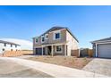 Inviting home with a cozy front yard, complemented by a driveway and a partially fenced boundary at 7662 W Rowel Rd, Peoria, AZ 85383