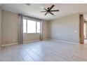 Bright living room with tile flooring and neutral color palette at 8026 W Wood Ln, Phoenix, AZ 85043