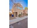 Two-story house with a tan facade and landscaping at 1127 W Auburn St, Mesa, AZ 85201