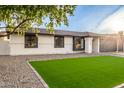 Single-story home with artificial turf and new landscaping at 1243 N Terripin --, Mesa, AZ 85207