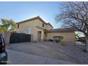 View of house showing side yard and gate at 12701 W Paradise Dr, El Mirage, AZ 85335
