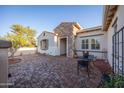 Cozy outdoor patio with brick flooring and seating perfect for enjoying peaceful moments at 12953 W Figueroa Dr, Sun City West, AZ 85375