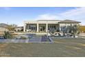 Single-story home with a large backyard, pool, and covered patio at 14821 E Chandler Heights Rd, Chandler, AZ 85249