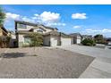 Two-story house with a three-car garage and desert landscaping at 14866 W Windsor Ave, Goodyear, AZ 85395
