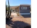 Side view of mobile home showcasing covered walkway at 156 N Hawes Rd # 75, Mesa, AZ 85207