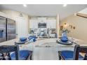 Modern kitchen featuring white cabinets, granite countertops, and stainless steel appliances at 16238 N 161St Dr, Surprise, AZ 85374