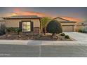 Charming house with stone accents and desert landscaping at 17531 W Liberty Ln, Goodyear, AZ 85338