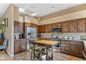 Spacious kitchen with wood cabinets and stainless steel appliances at 27608 N Montana Dr, Rio Verde, AZ 85263