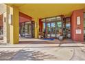 Inviting building entrance with glass doors, potted plants, and decorative concrete, creating an elegant welcome at 310 S 4Th St # 908, Phoenix, AZ 85004