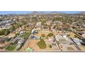 Aerial view of neighborhood, showing a house under construction and surrounding homes at 3312 E Flower St, Phoenix, AZ 85018