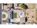 Aerial view of house with pool, large backyard, and circular driveway at 3312 E Flower St, Phoenix, AZ 85018