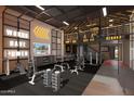 Modern gym with extensive equipment, motivational signage, and dedicated workout space for fitness enthusiasts at 3312 E Flower St, Phoenix, AZ 85018
