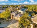 Two-story house with solar panels, desert landscaping, and mountain views at 4516 E Madre Del Oro Dr, Cave Creek, AZ 85331