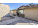 Brick building exterior with a walkway and landscaping at 4720 E Belleview St, Phoenix, AZ 85008