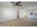 Bright living room with hardwood floors and a ceiling fan at 4720 E Belleview St, Phoenix, AZ 85008