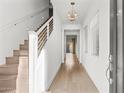 Bright entryway with hardwood floors and modern staircase at 6924 E Lyra Dr, Scottsdale, AZ 85257
