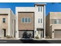 Contemporary three-story home with attached garage at 6924 E Lyra Dr, Scottsdale, AZ 85257