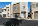 Modern home exterior with neutral color palette and landscaping at 6924 E Lyra Dr, Scottsdale, AZ 85257