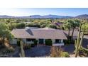 Single-story home with mountain views and desert landscaping at 7760 E Carefree Dr, Carefree, AZ 85377