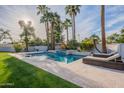 Inviting backyard oasis with a sparkling pool and comfortable lounge chairs at 9254 N 82Nd St, Scottsdale, AZ 85258