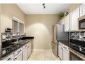 Modern kitchen with stainless steel appliances and granite countertops at 11260 N 92Nd St # 1102, Scottsdale, AZ 85260