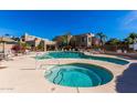 Community pool and spa with surrounding patio at 11260 N 92Nd St # 1102, Scottsdale, AZ 85260