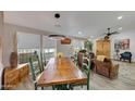 Bright dining area with a rustic wooden table and leather armchairs at 11596 W Sierra Dawn -- # 132, Surprise, AZ 85378