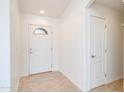 Bright entryway with tiled floors and neutral walls at 14595 S Tampico Rd, Arizona City, AZ 85123