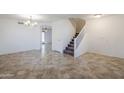 Bright dining room with tiled floors and a chandelier at 16649 W Polk St, Goodyear, AZ 85338